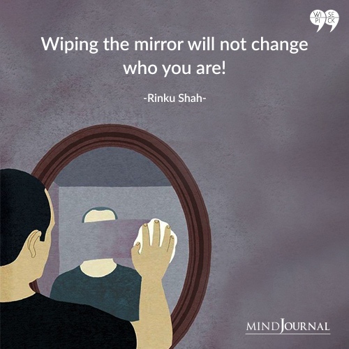 Rinku Shah wiping the mirror